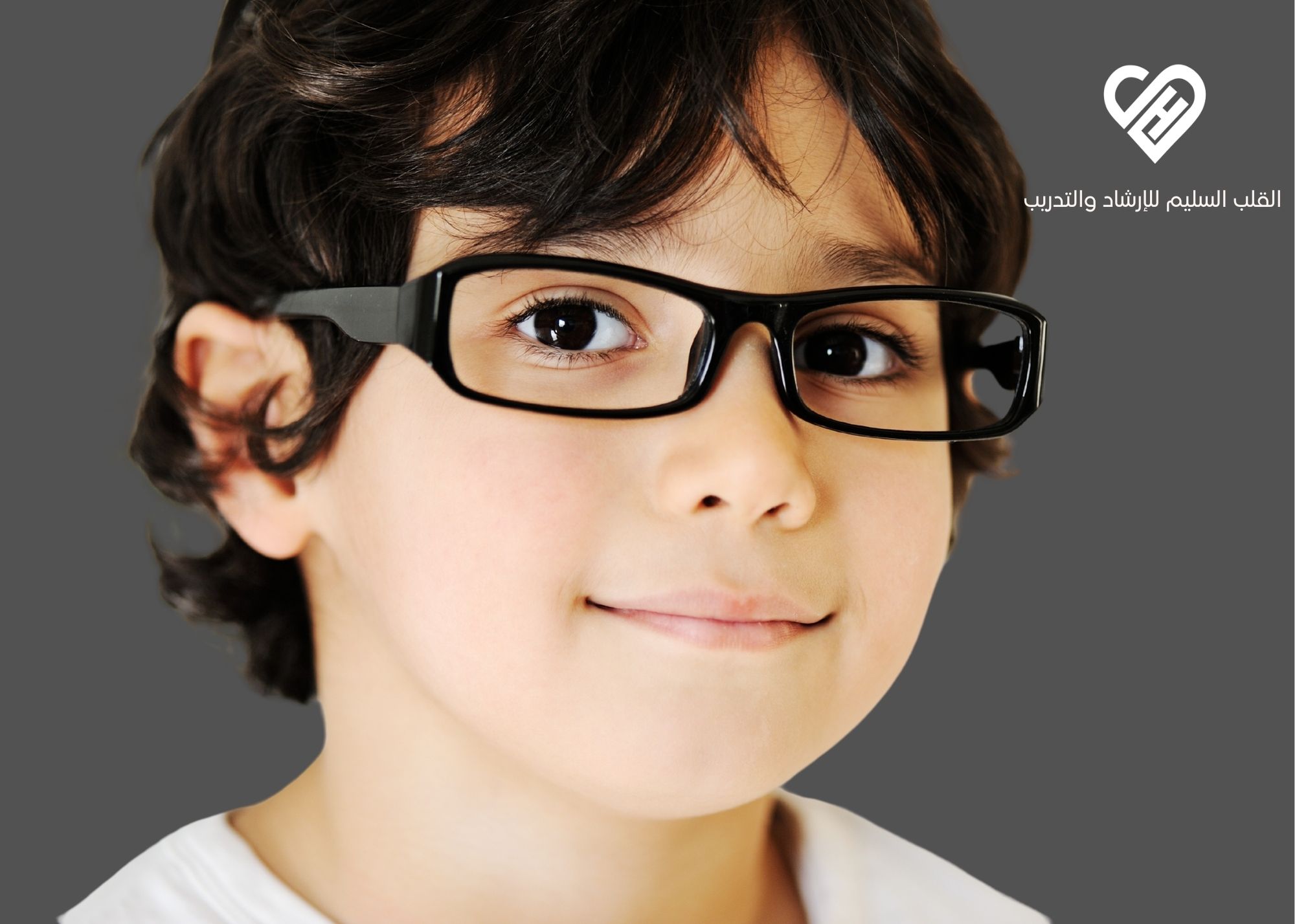 face of male confident child with smile wearing glasses 